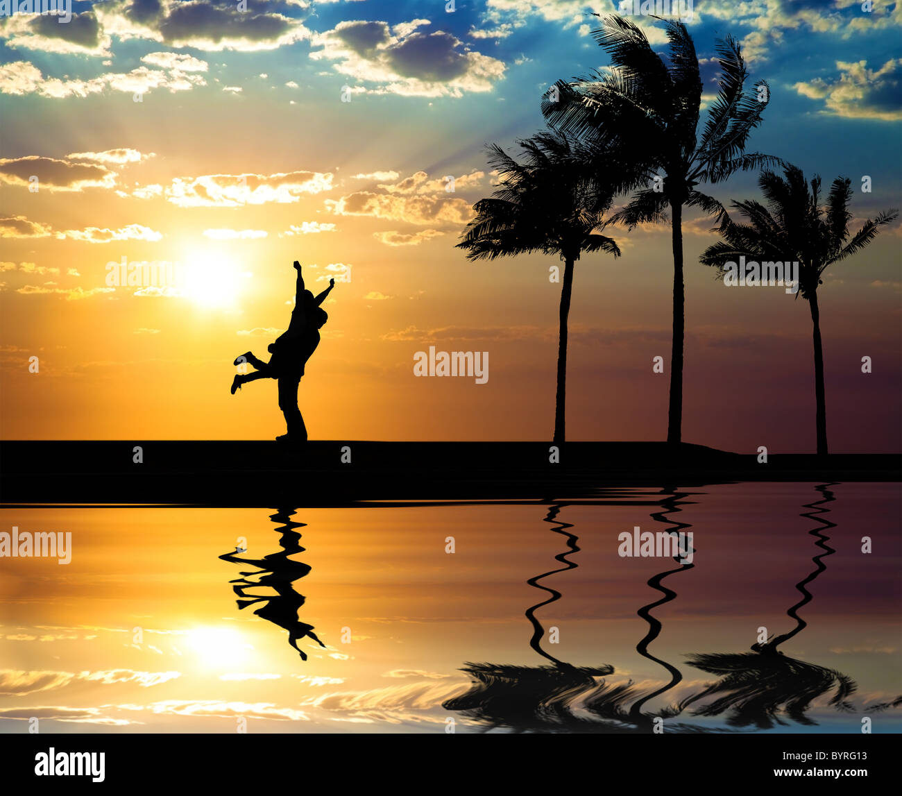 Beautiful sunset on the beach and the silhouette of happy couple Stock ...