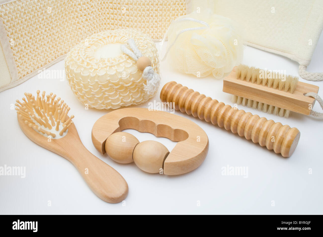 Bath set - sisal/cotton back massage belt, massage brush with wooden studs, massage roller, sponge, loofah, nylon tuff. Stock Photo