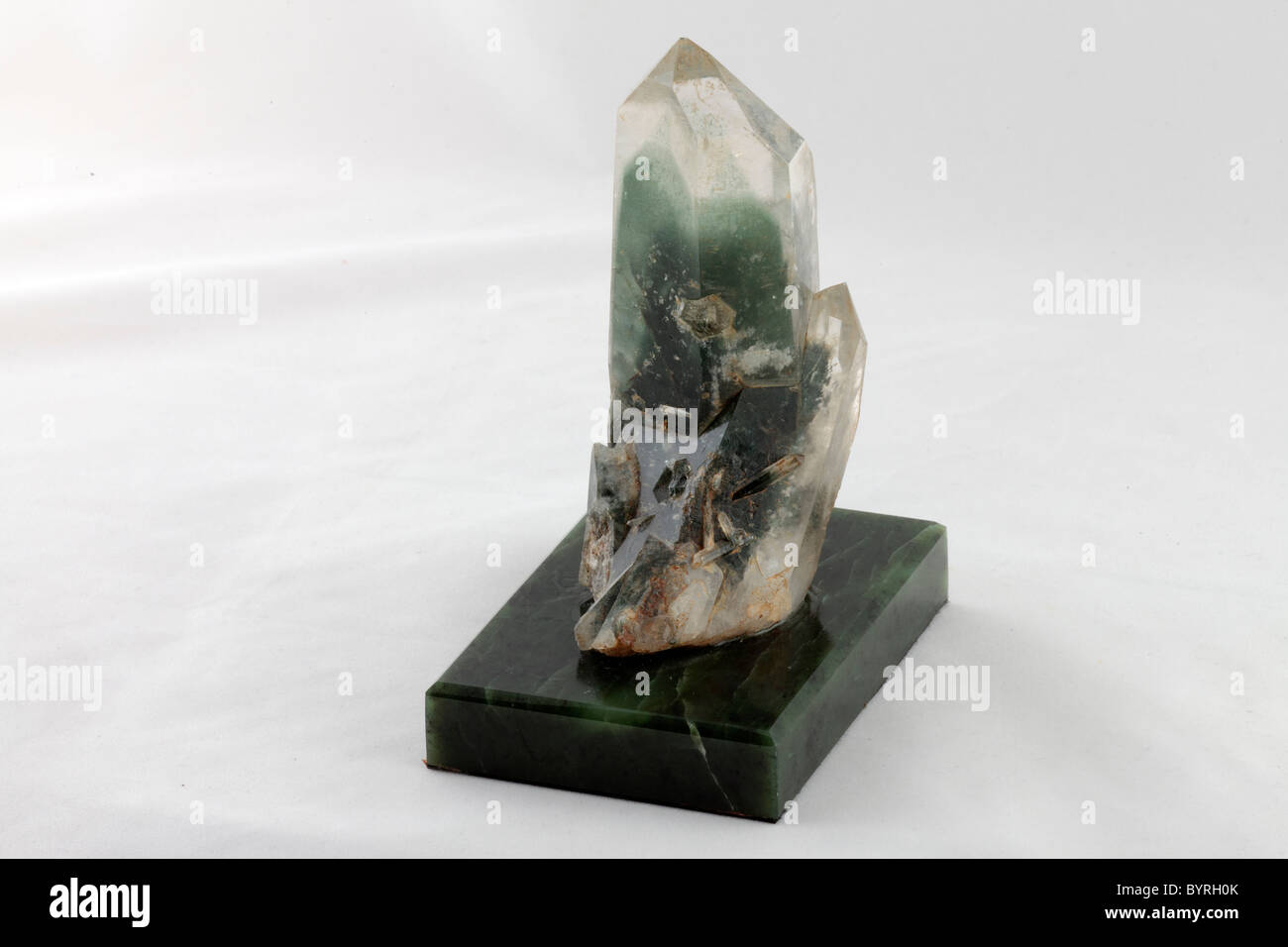 Large crystals of the rare rock crystal on a stand Stock Photo