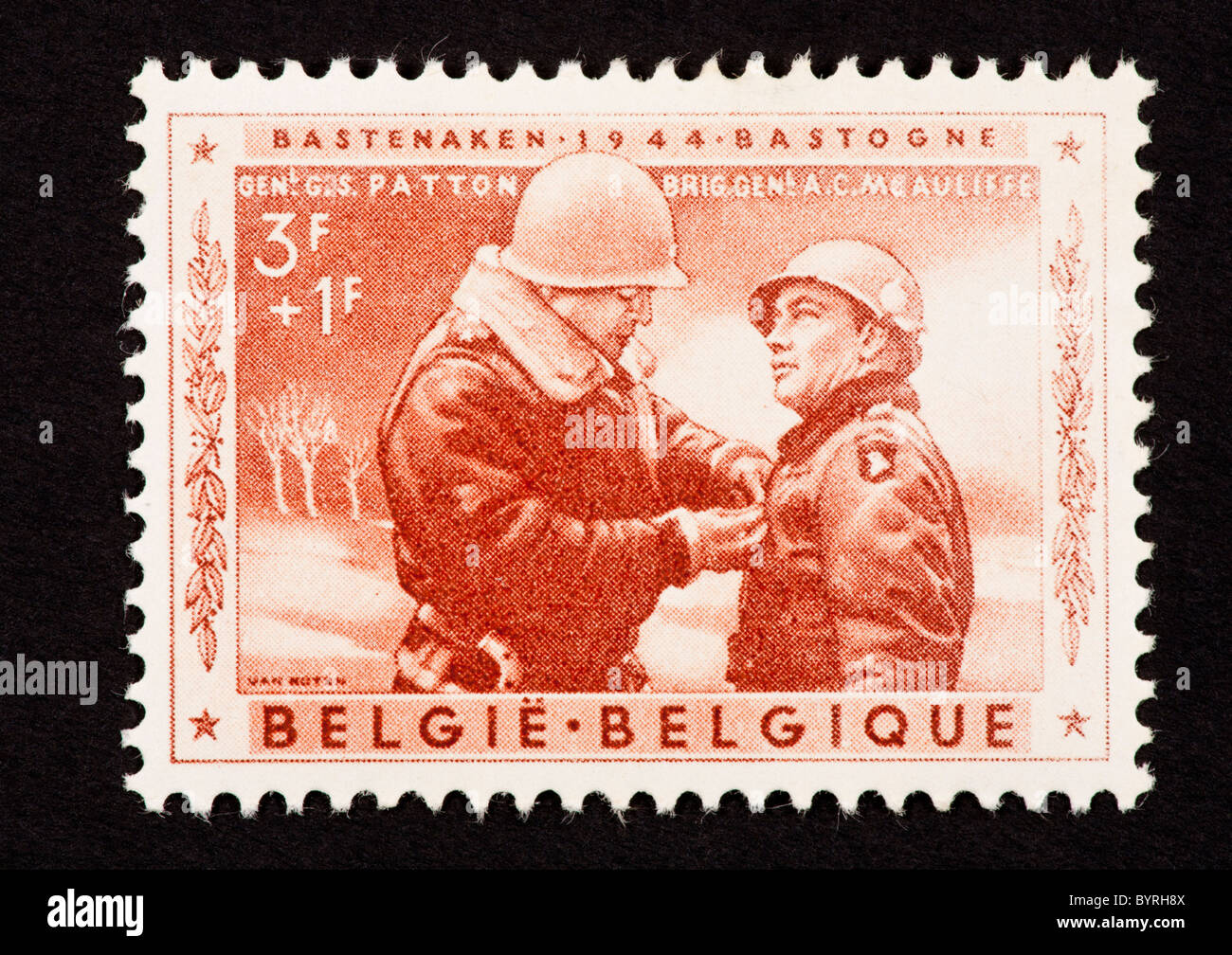 Postage stamp from Belgium depicting Patton pinning a medal on a soldier. Stock Photo