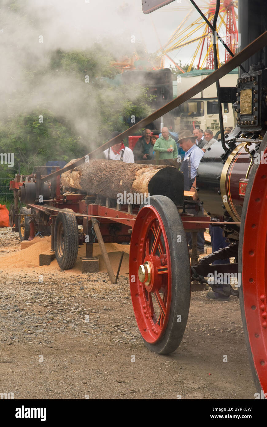 Log Sawing By Steam Propelled Traction Engine Operating A Saw