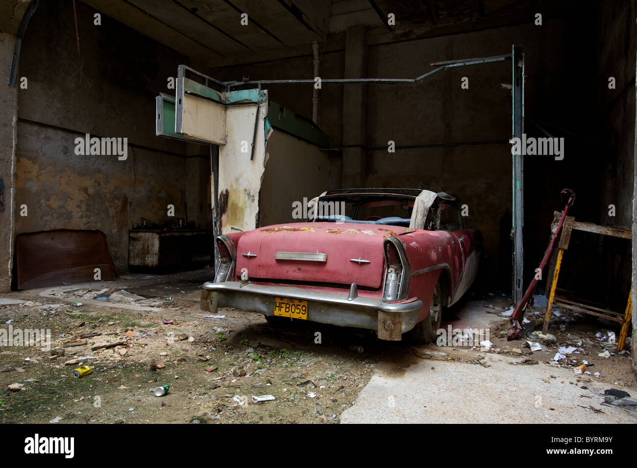 Remains of An old American car in a Cuban garage in Havana. Stock Photo