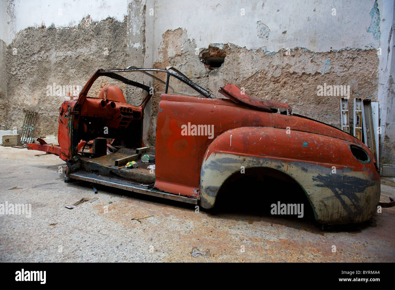Remains of An old American car in a Cuban garage in Havana. Stock Photo