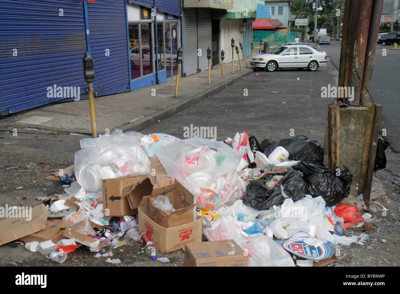 Panama,Latin,Central America,Panama City,Calidonia,lower class neighborhood,street scene,trash pile,garbage,pollution,plastic bags,street,sidewalk,par Stock Photo