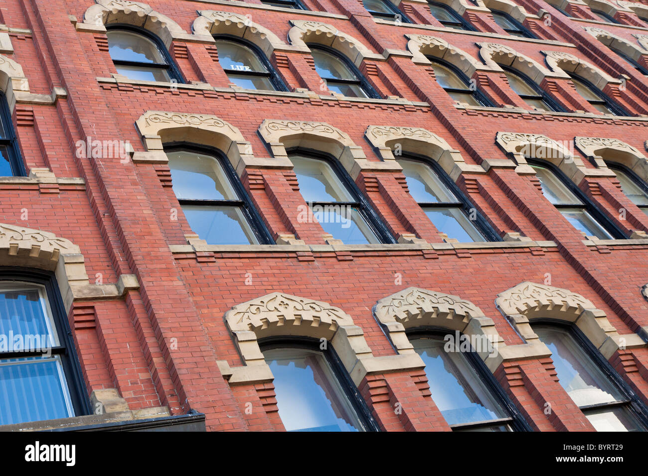 Decorative arches over windows in brick building in Saint John, New Brunswick, Canada Stock