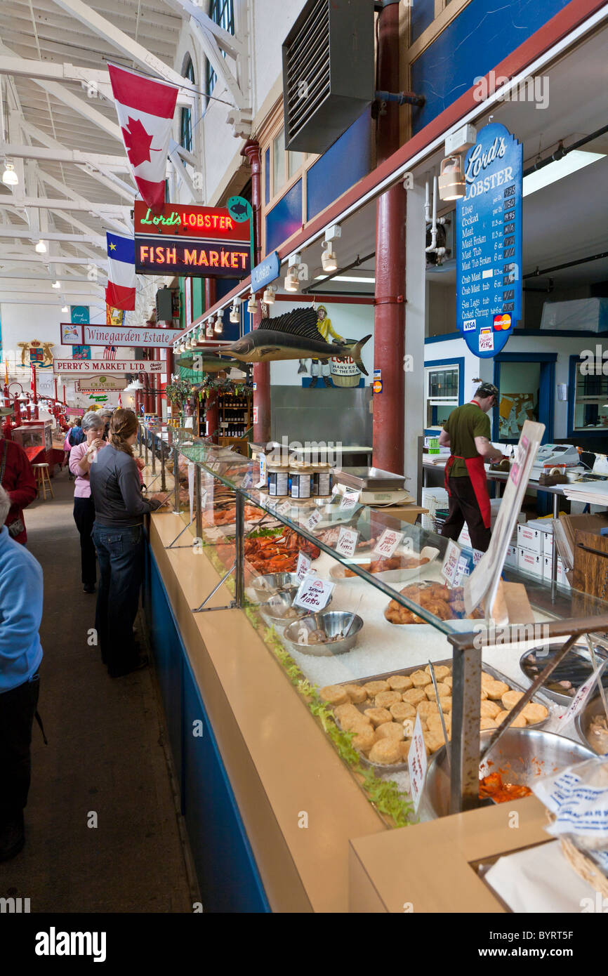 Shoppers inspect the food at Lord's Lobsters Fish Market inside City Market in Saint John, New