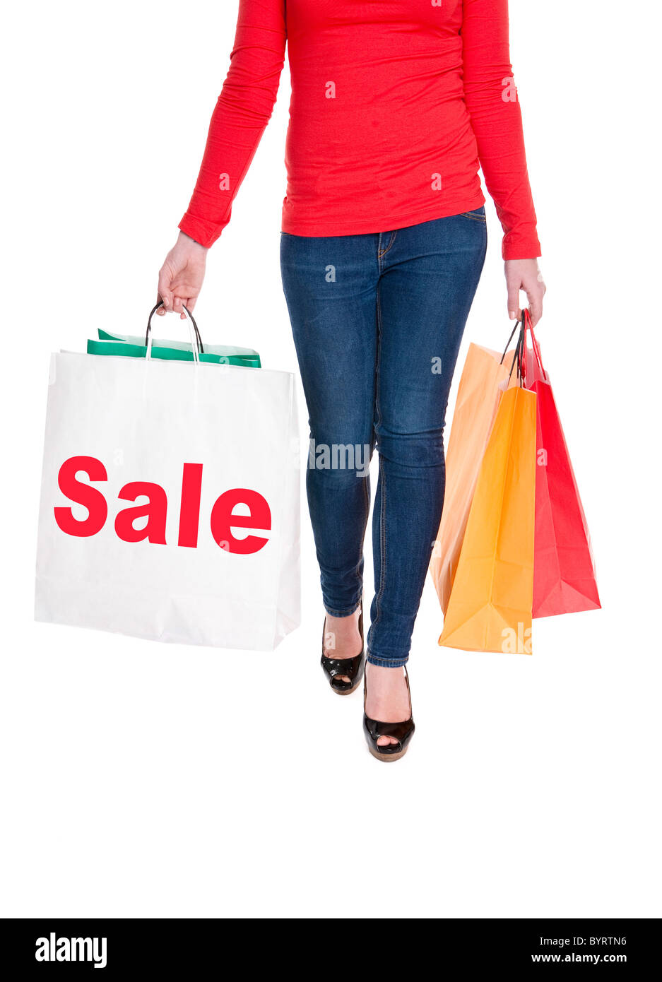 close-up of woman holding shopping bags displaying the sale sign Stock Photo