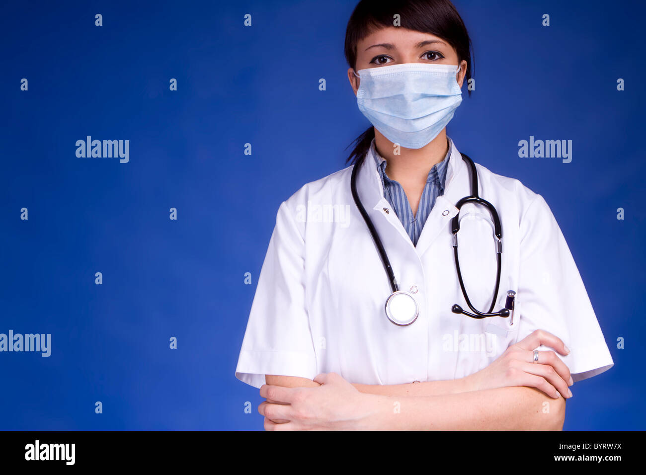 Wearing mask working young hi-res stock photography and images - Alamy