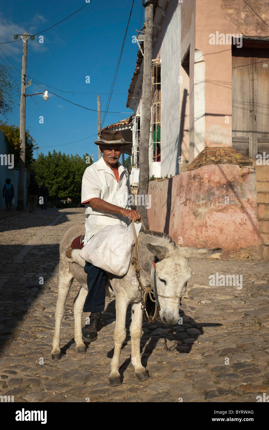 Old man with hat on his donkey , Trinidad, Sancti Spiritus, Cuba. Stock Photo