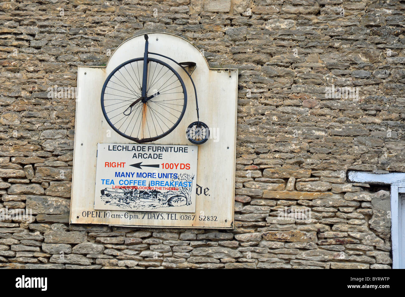 Lechlade, Gloucester, England: penny farthing bicycle sign for antique shop Stock Photo