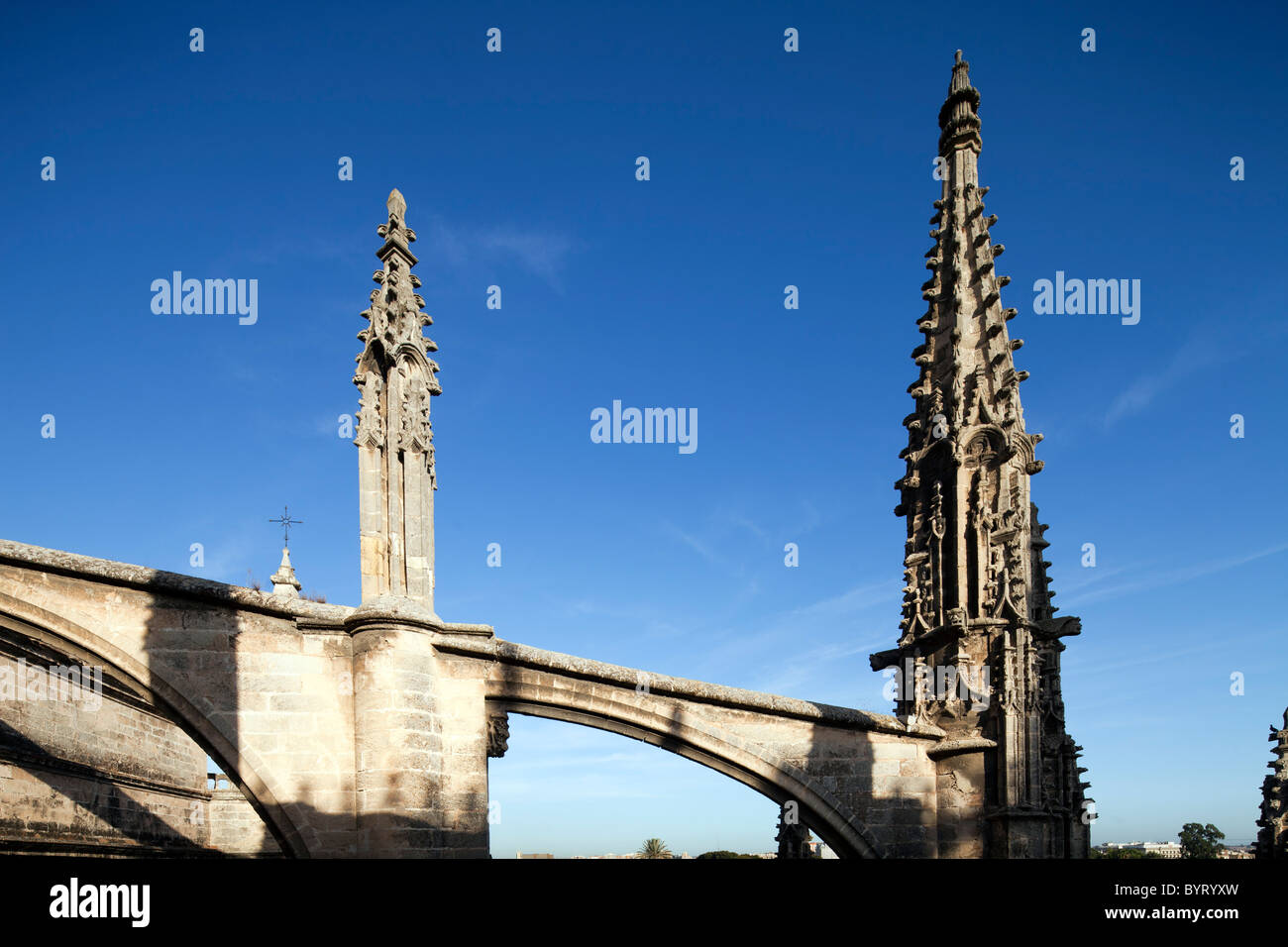 Gothic flying buttress and pinnacle on the roof of Santa Maria de la Sede Cathedral, Seville, Spain Stock Photo