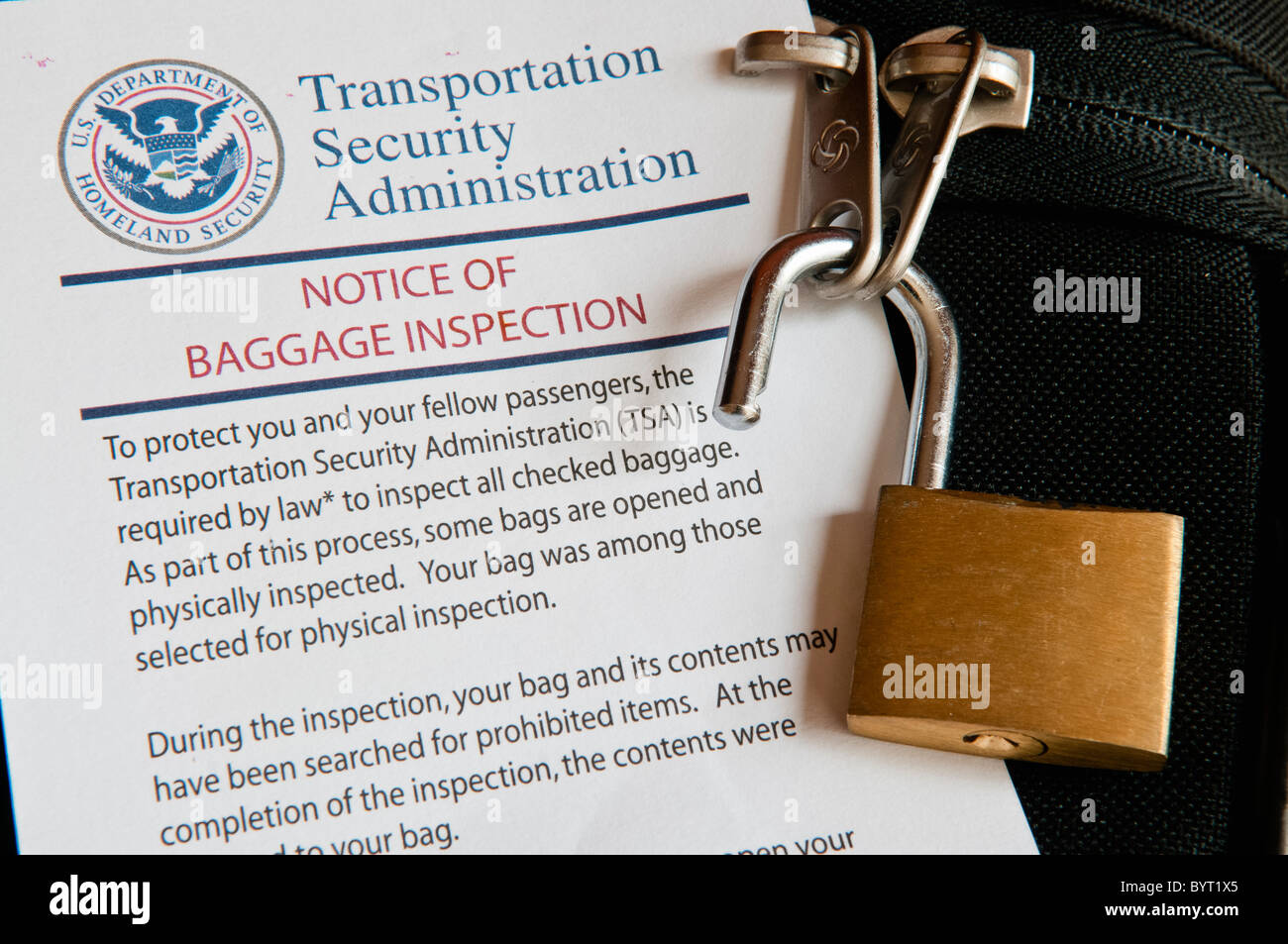 TSA Notice of Baggage Inspection with an open lock on a suitcase Stock  Photo - Alamy
