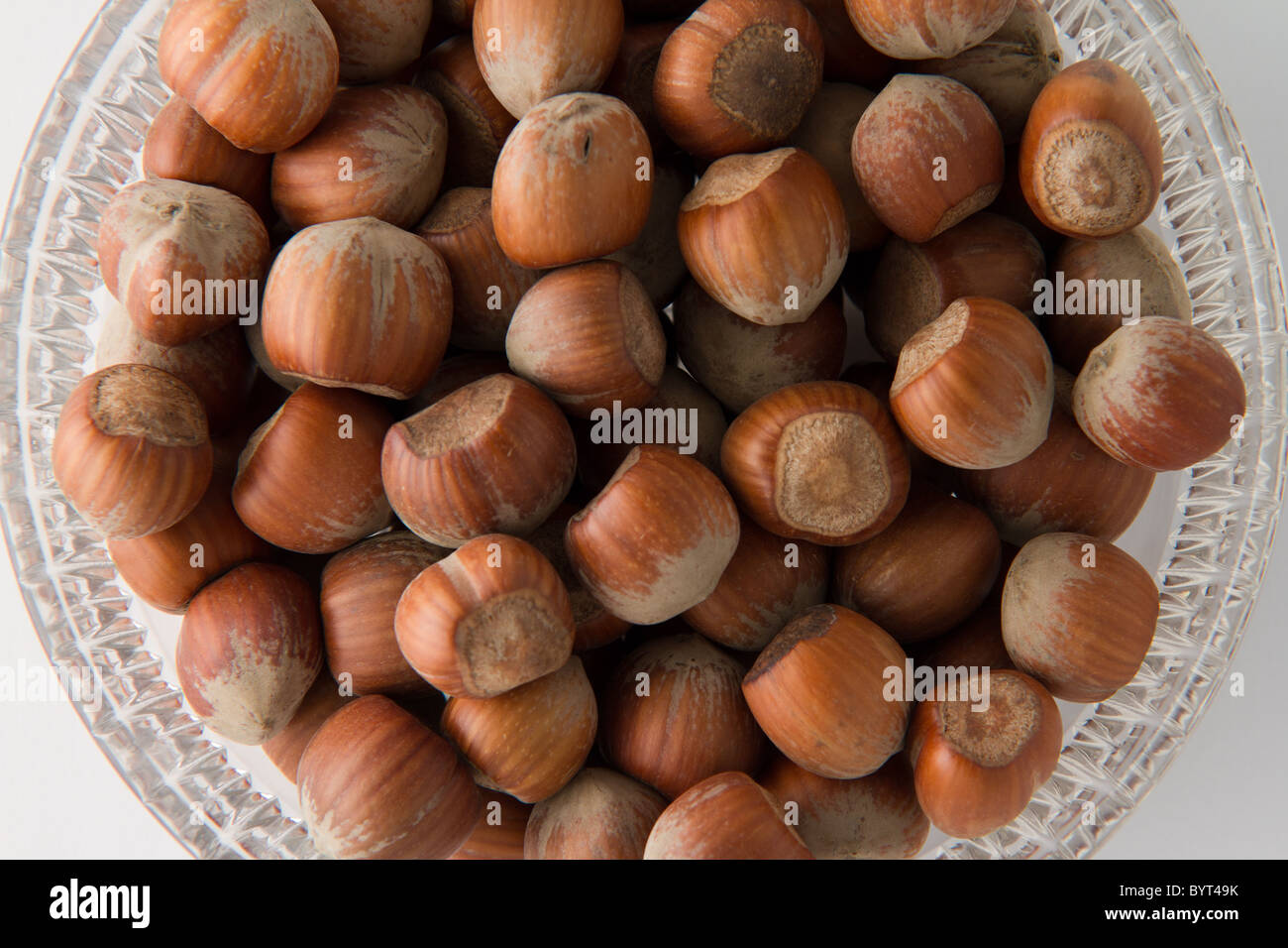 Top view of hazelnuts in glass bowl Stock Photo