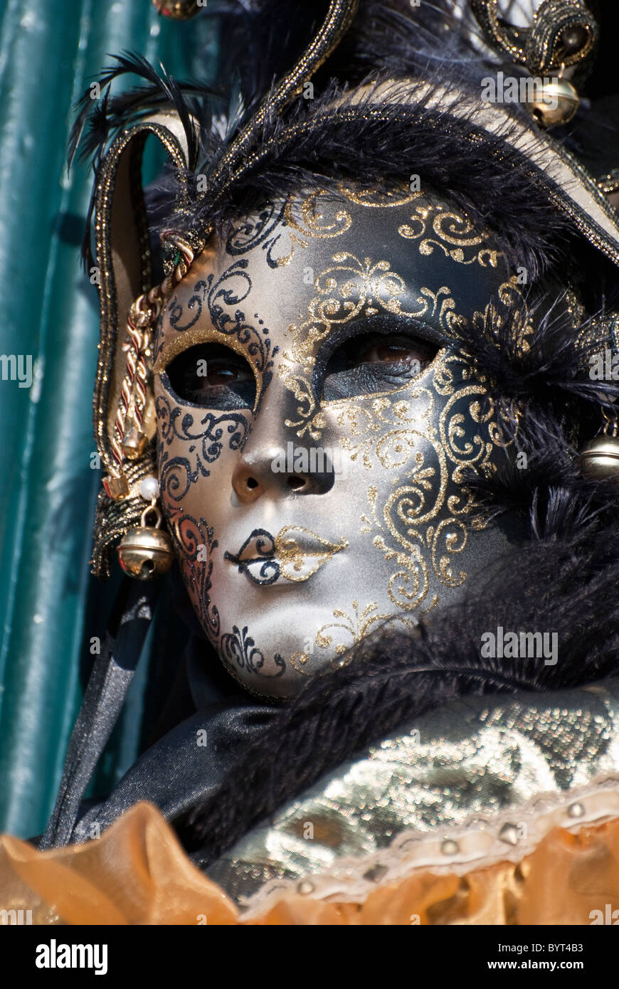 Single Venetian mask during carnival in disguise with black and gold ...