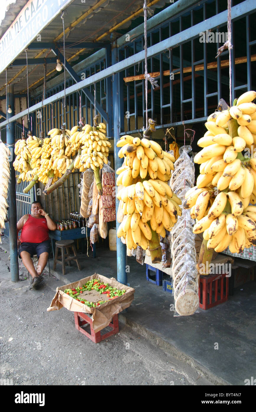 Banana seller in a market stall in Caracas Venezuela Stock Photo Alamy