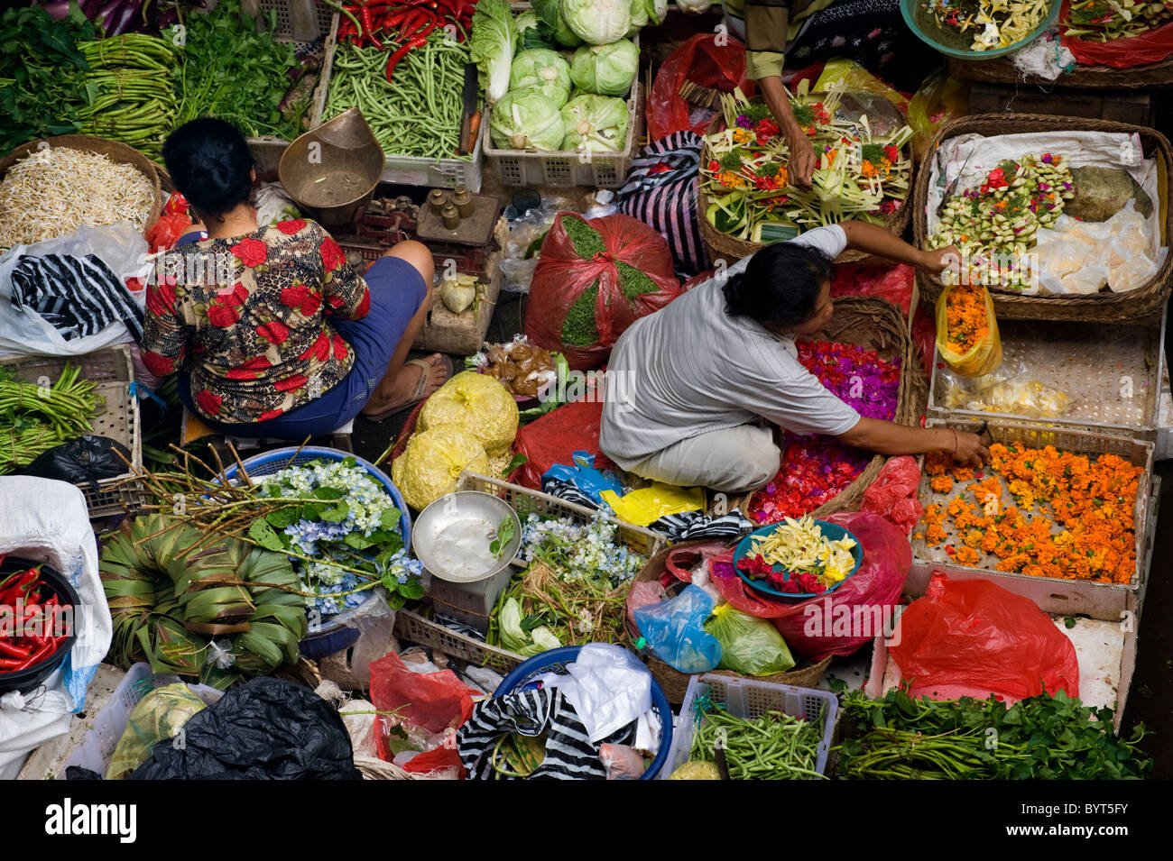 The public market in Ubud, Bali, is a colorful and busy place in the early morning when Balinese