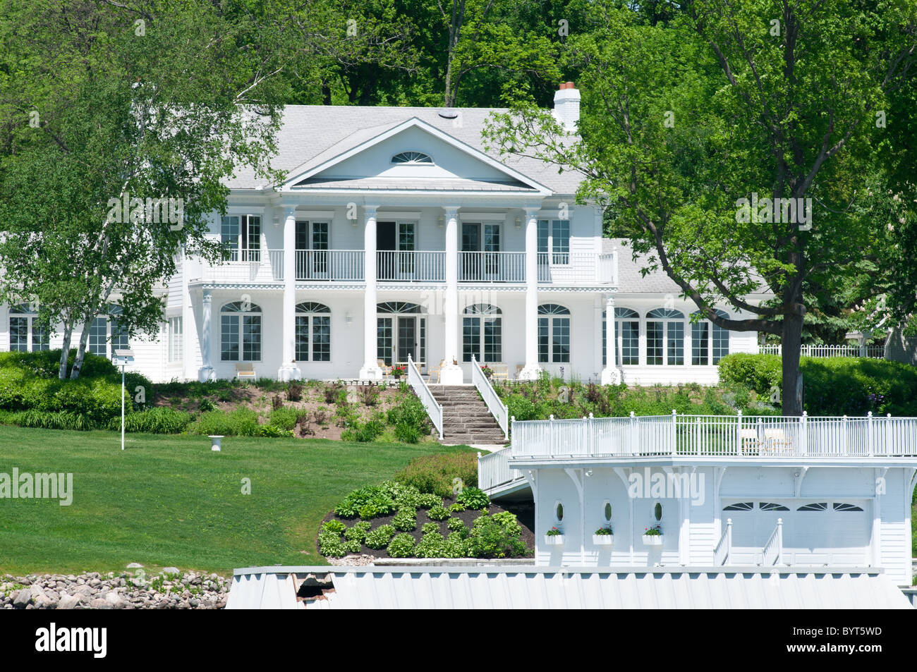 Large white mansion with dock Stock Photo Alamy