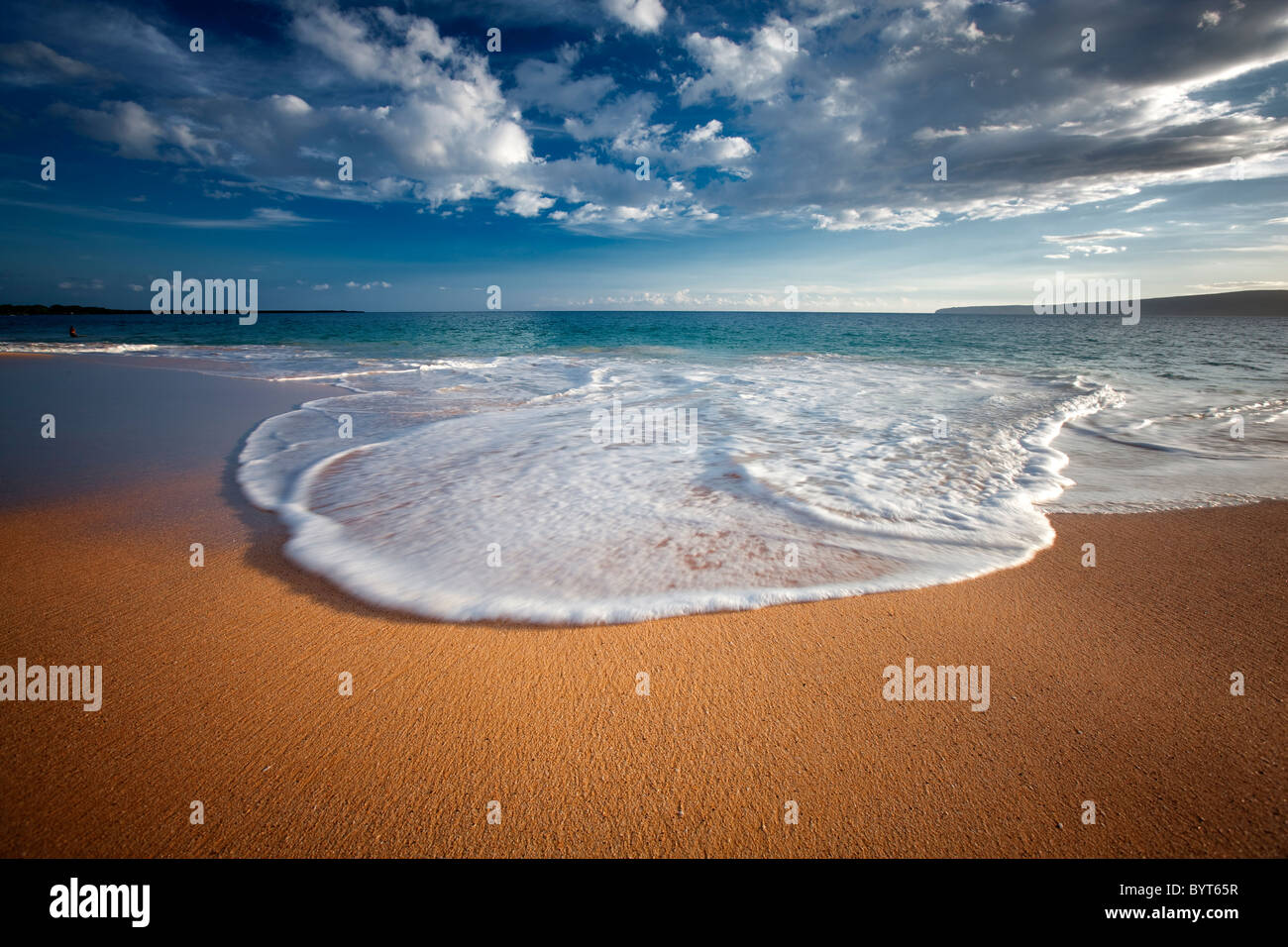 Beach, wave and clouds. Maui, Hawaii. Stock Photo