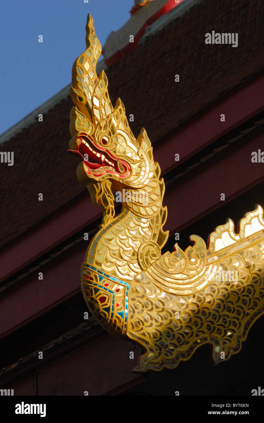 A Naga on the roof of the Wat Phra Singh in Chiang Mai, Thailand Stock Photo