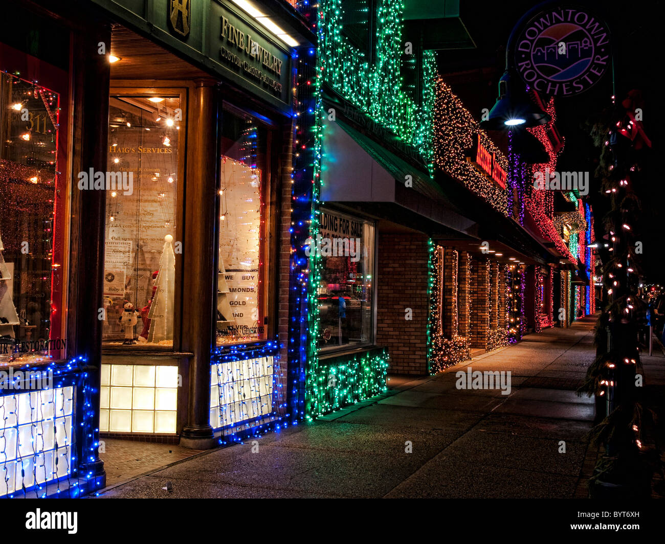 Store fronts on the main street in Rochester Michigan lit up for the