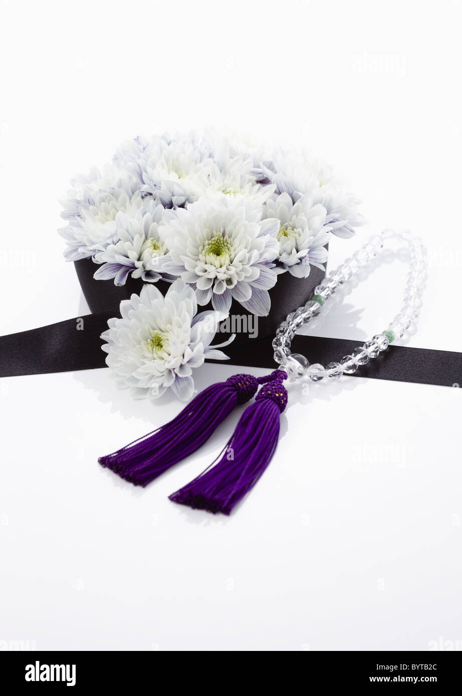 Chrysanthemum flower arrangement and beadroll (mourning image Stock Photo Alamy