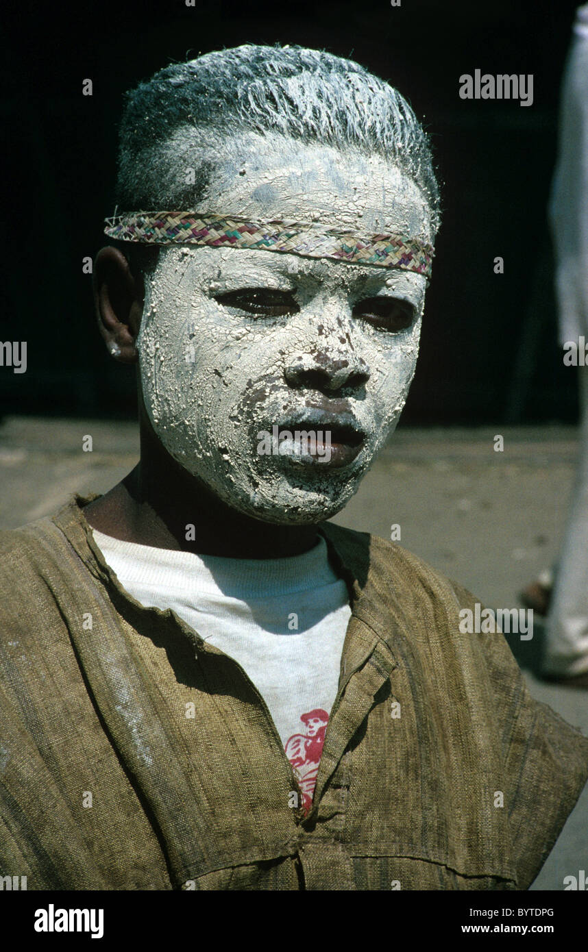 Malagasy Boy Warrior in War Paint, Face Paint or Face Mask, at Sambatra Circumcision Festival, Mananjary, Madagascar Stock Photo
