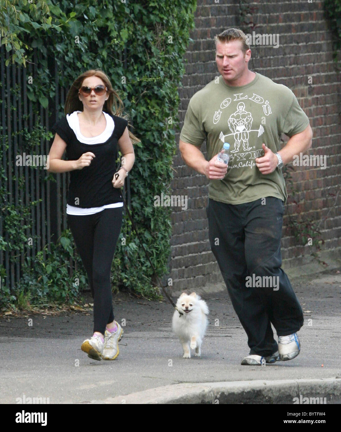 Geri Halliwell and her personal fitness instructor Tim Blakeley leave  Geri's house to go for a jog with her dog "daddy". It was Stock Photo -  Alamy