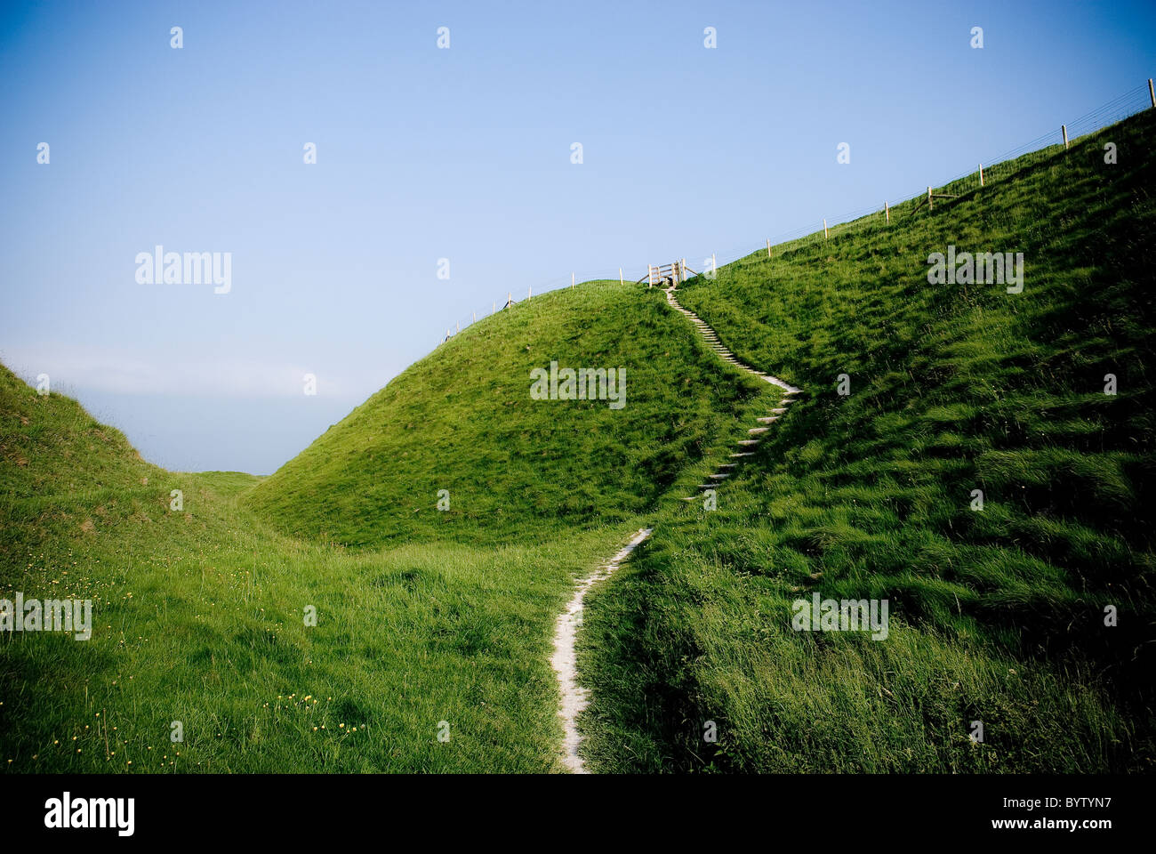Chalk banks and ditches at Maiden Castle Iron Age Hillfort near Dorchester, Dorset, UK Stock Photo