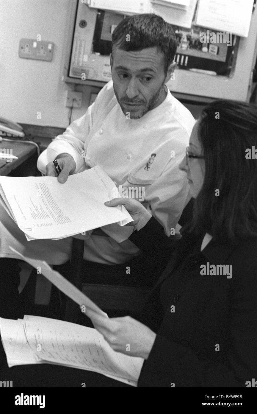 Chef Michel Roux jr at Le Gavroche with the accountant of the restaurant Stock Photo