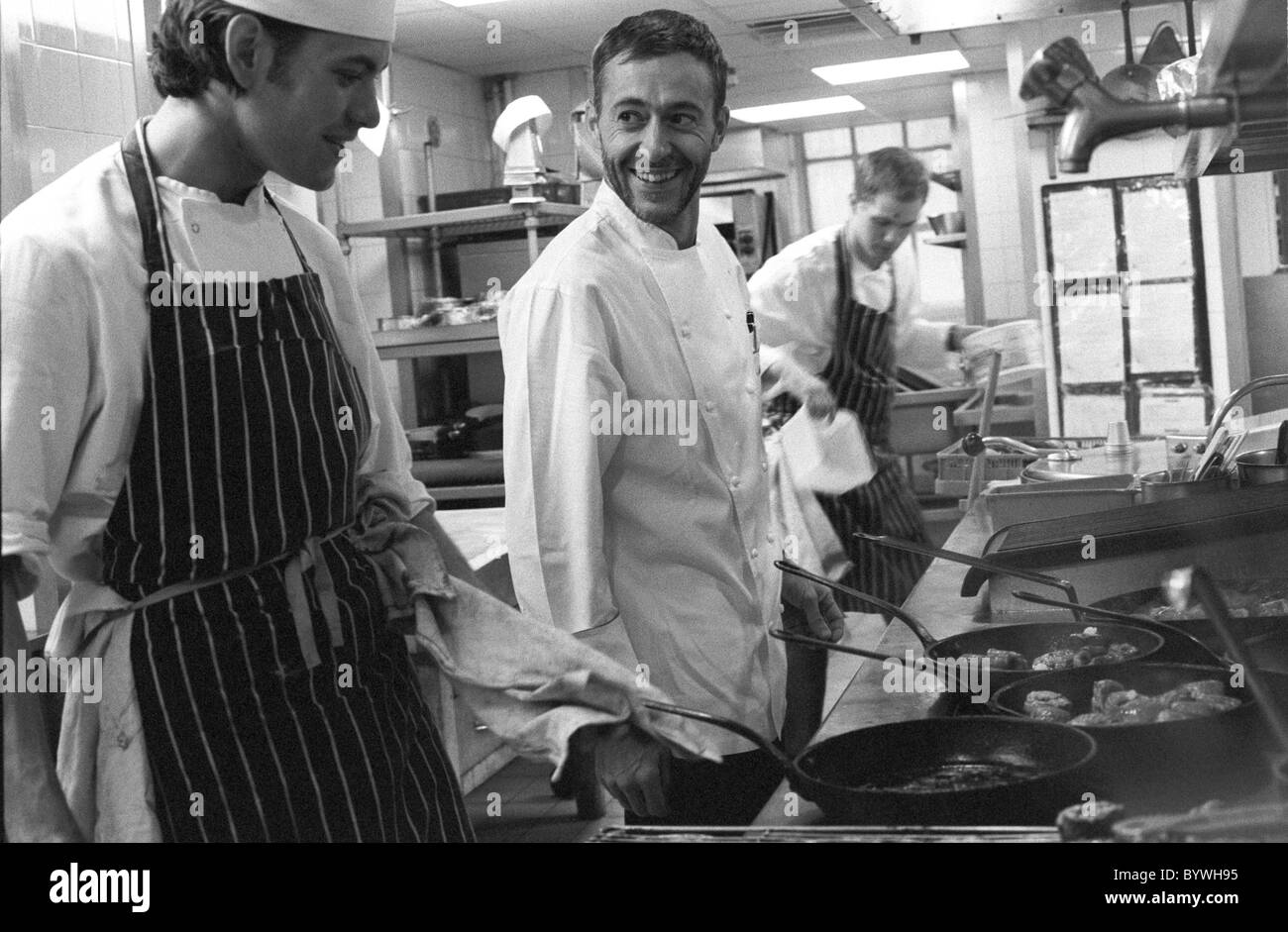 Chef Michel Roux at Le Gavroche chatting with one of his sous chefs Stock Photo