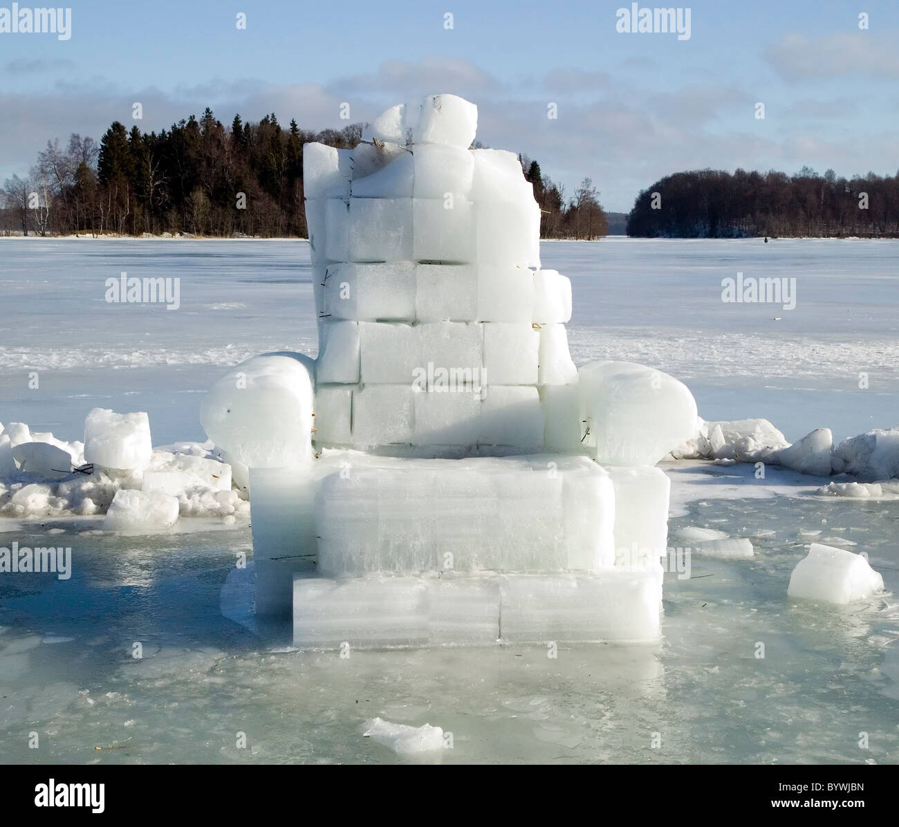 Sculpture made from snow and ice is standing on lake Stock Photo