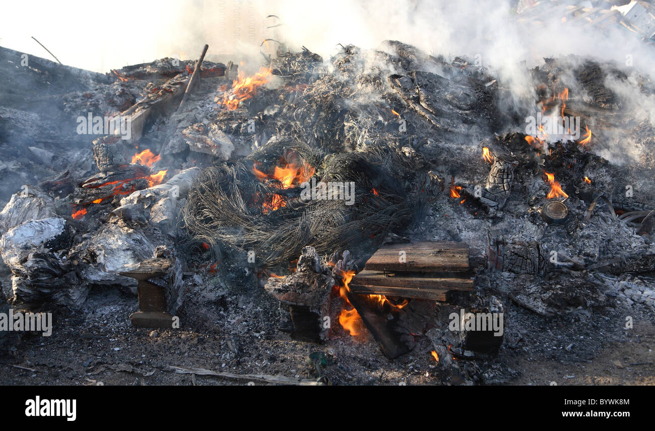 Rubbish burning a fly tipping site Stock Photo