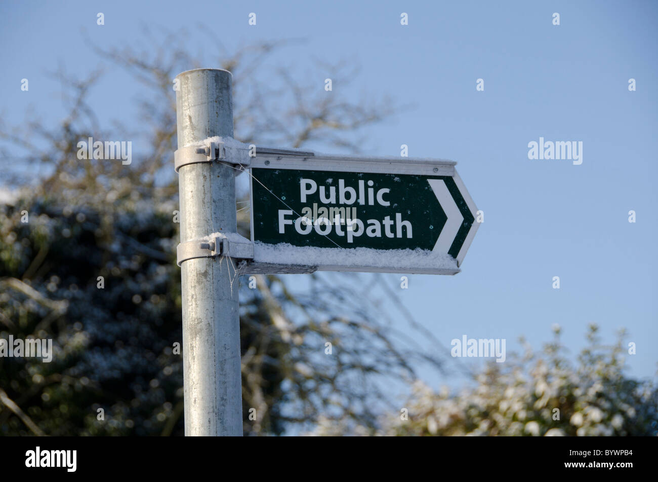 A Public Footpath Sign in Bramcote, Nottingham in snowy conditions. Stock Photo