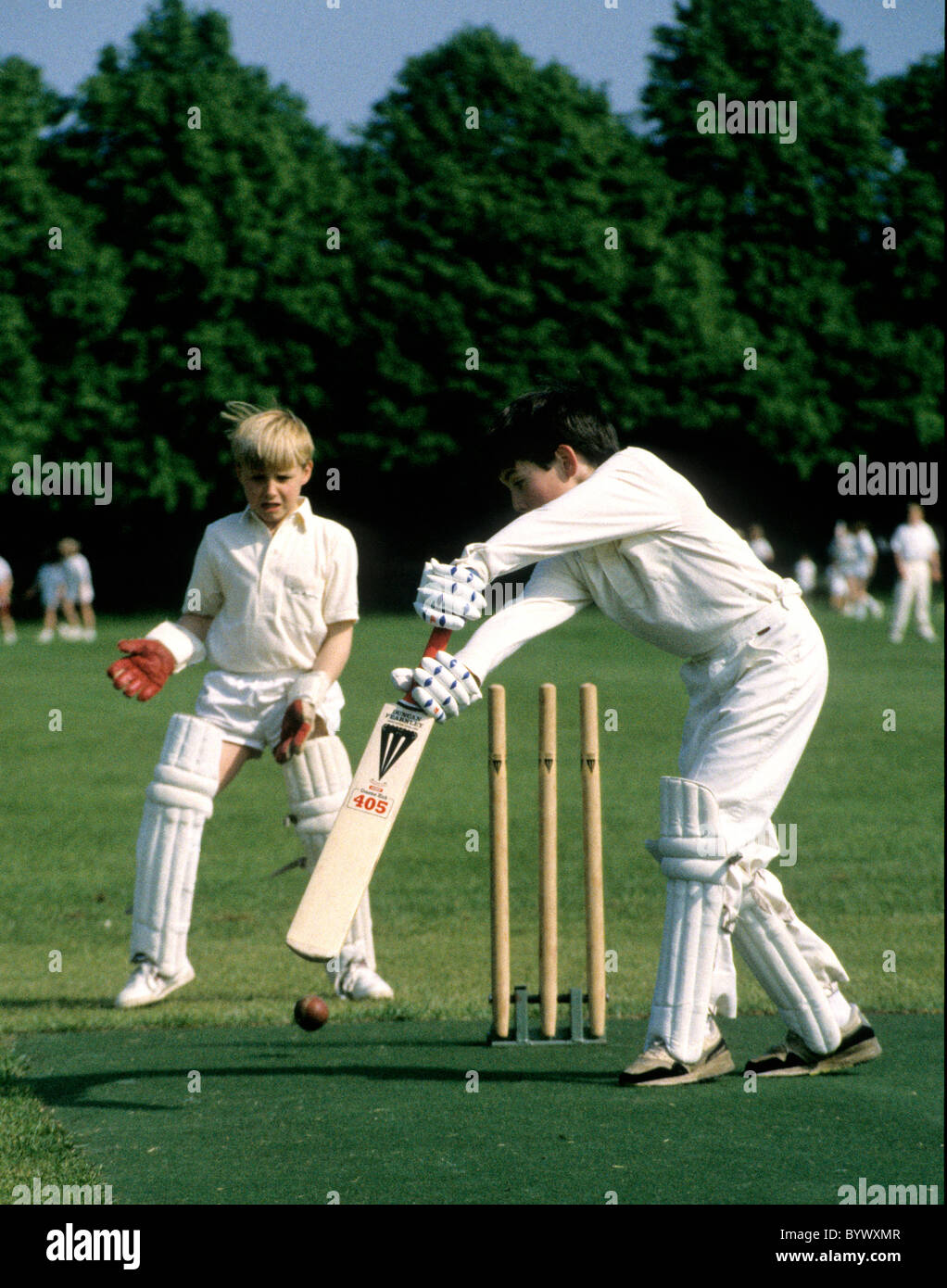 schoolboys playing cricket Stock Photo