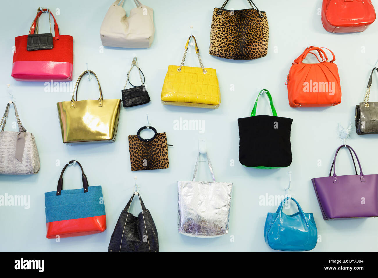A wall of handbags at the Kate Spade pop-up store in Covent Garden, London, England Stock Photo