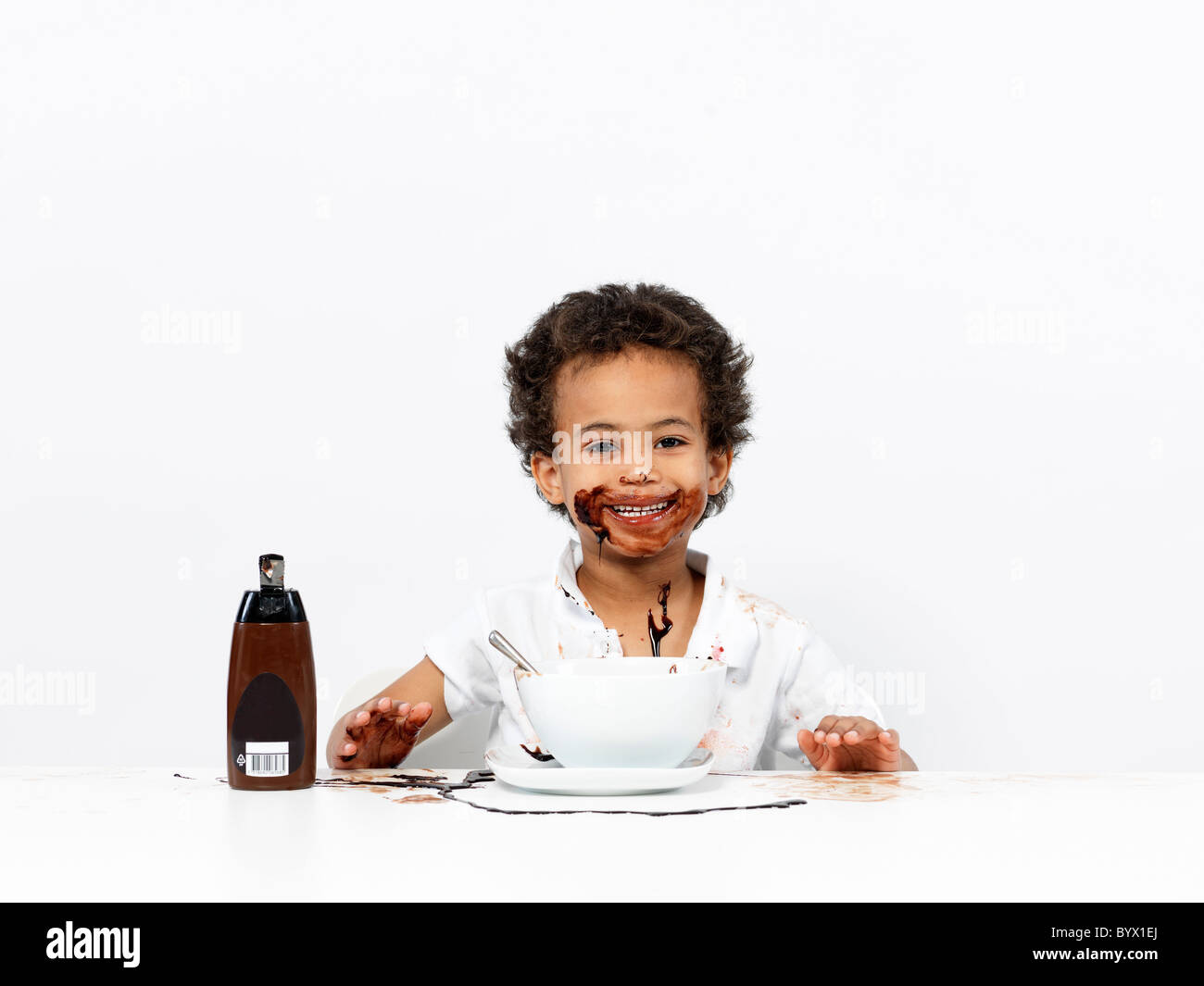 Boy covered in chocolate sauce Stock Photo Alamy