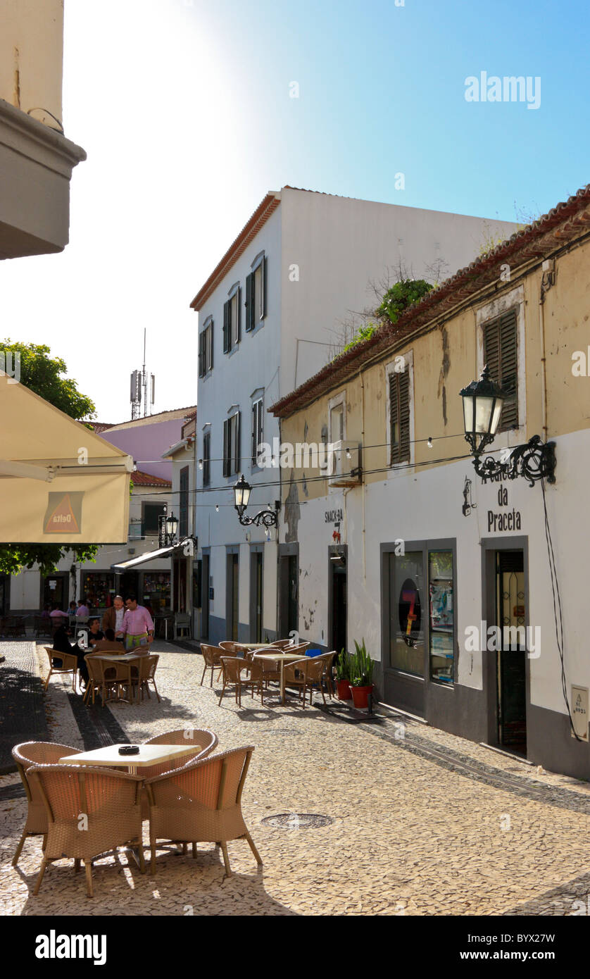 A narrow road with outside restaurants in Santa Cruz, Madeira Stock