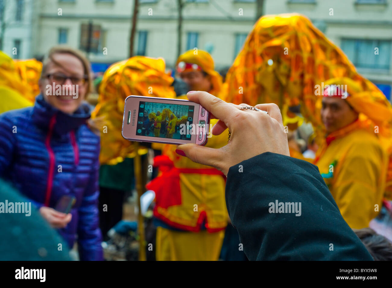 Paris, France, Street Scenes, Belleville Chinatown, Woman Taking Photos, Holding Smart Phone in hand, 'Chinese New Year' Stock Photo