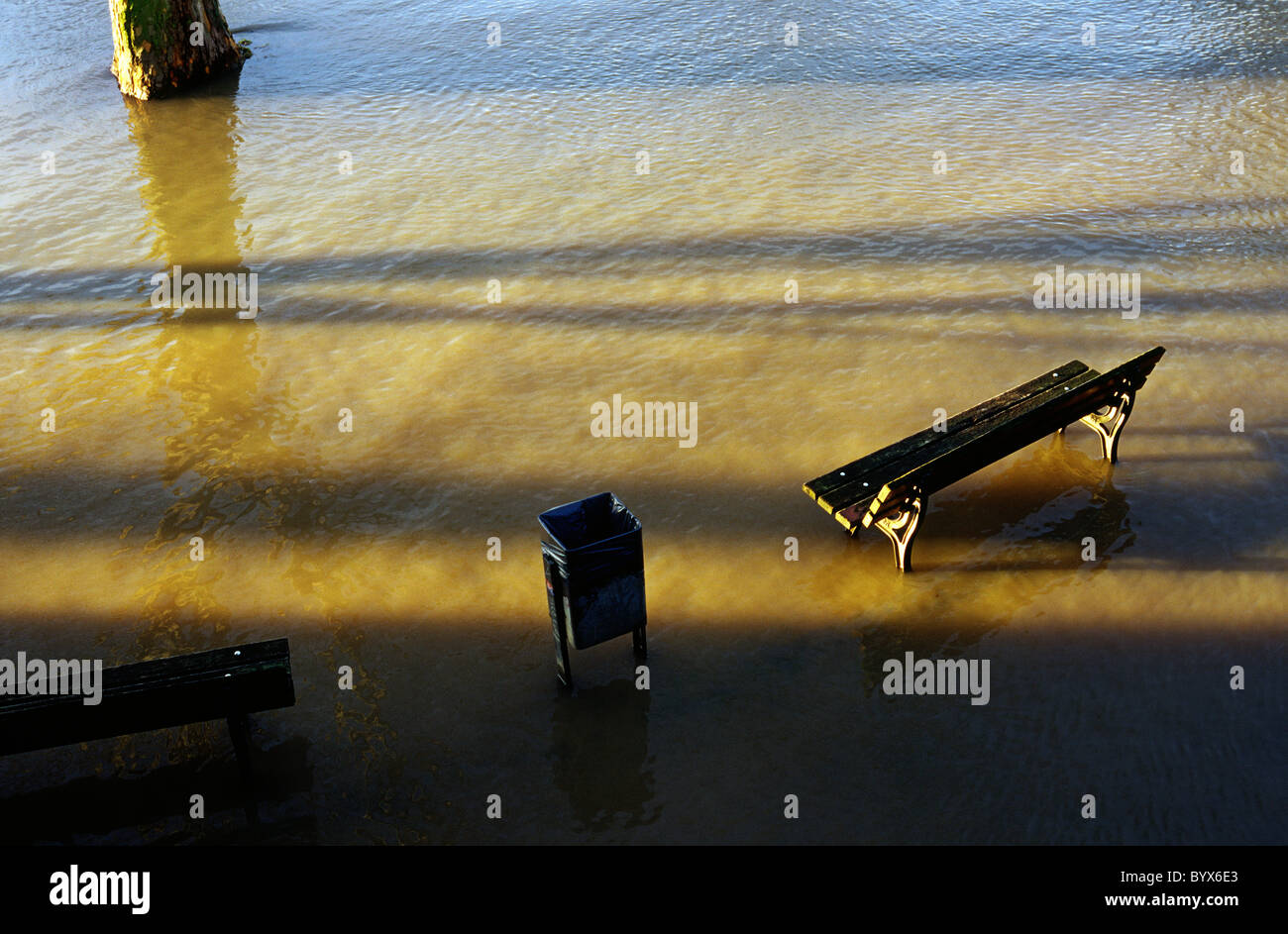 Melting snow in the south has caused the river Main to swell and flood its riverside promenade in the German city of Frankfurt. Stock Photo