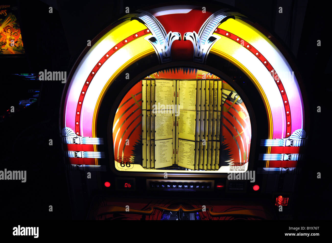 Front of a brightly coloured modern jukebox that plays CD's Stock Photo