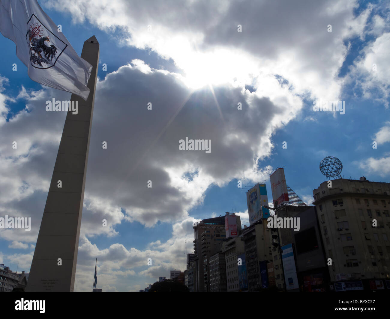 Argentine flag flies at the Obelisk at the Plaza de la Republica Buenos Aires Argentina Stock Photo