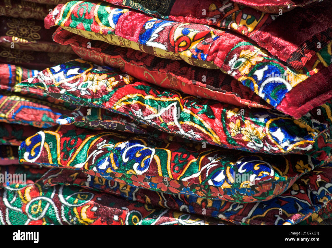 Velvet cushions for sale on a stall outside Chorsu Bazaar, Tashkent, Uzbekistan Stock Photo