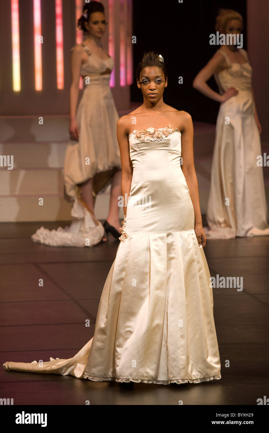long white dress young girl standing runway Stock Photo