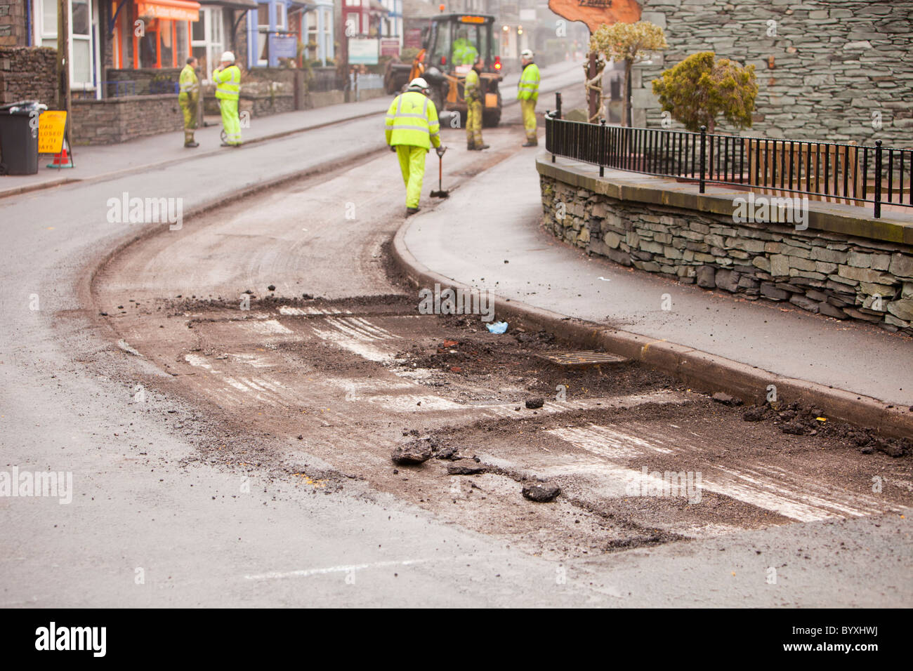 Resurfacing work taking place in Ambleside after floods and harsh winter weather caused serious erosion of the road surface. Stock Photo