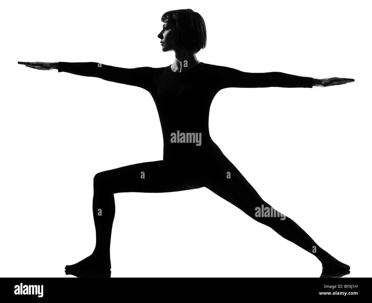 woman virabhadrasana warrior 2 postion yoga pose posture position in silouhette on studio white background Stock Photo