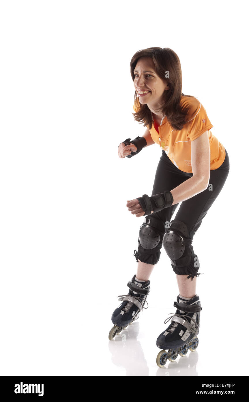 Woman inline skating Stock Photo