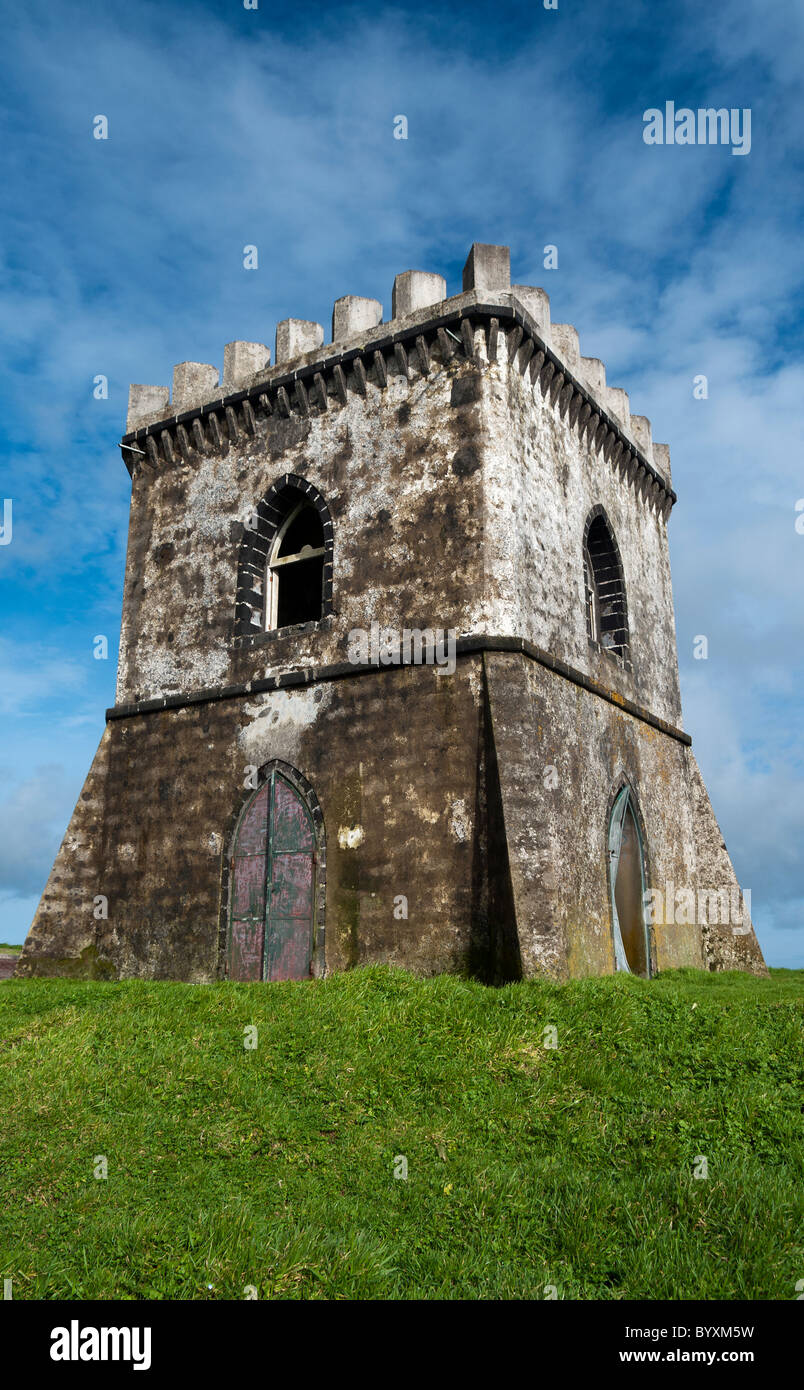 Old white Castle in the Azores. green grass in the foreground. Blue sky ...