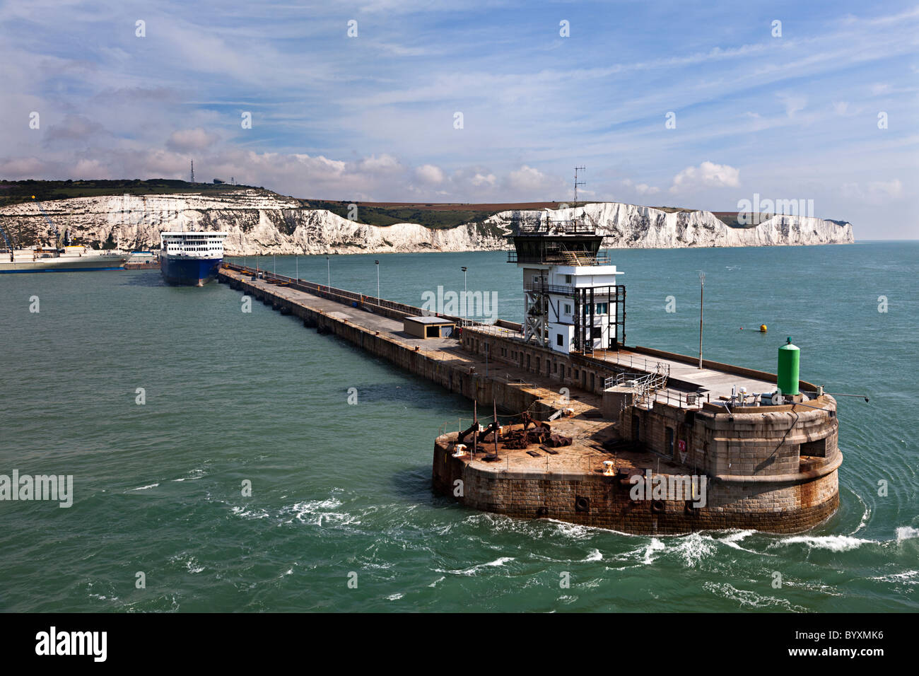 Harbour wall and white cliffs Dover England UK Stock Photo
