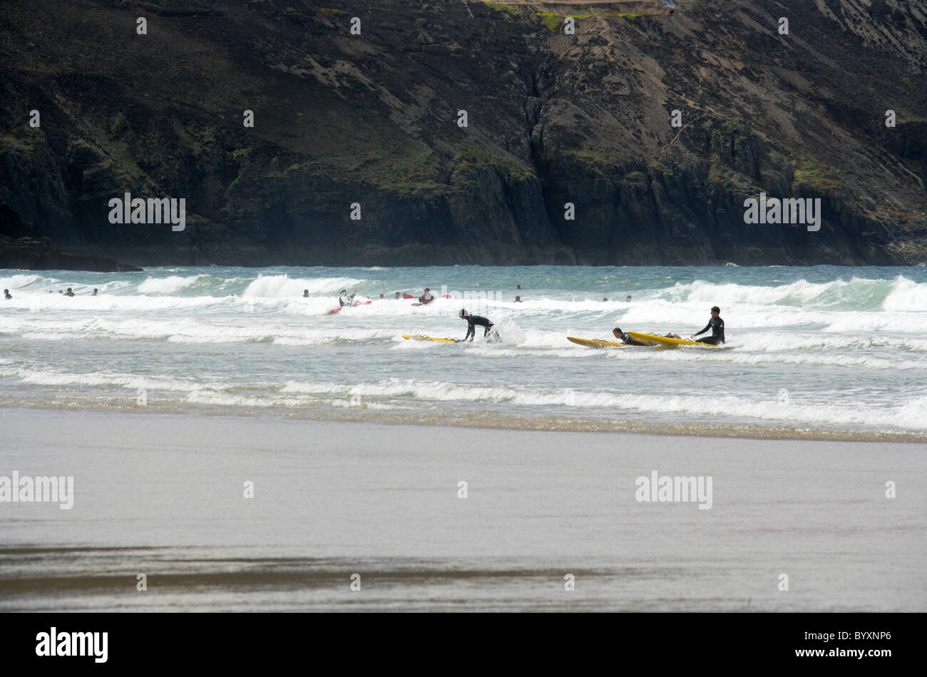Kayaking and Surfing, Perranporth Beach, North Cornwall Coast, Britain, UK. Stock Photo