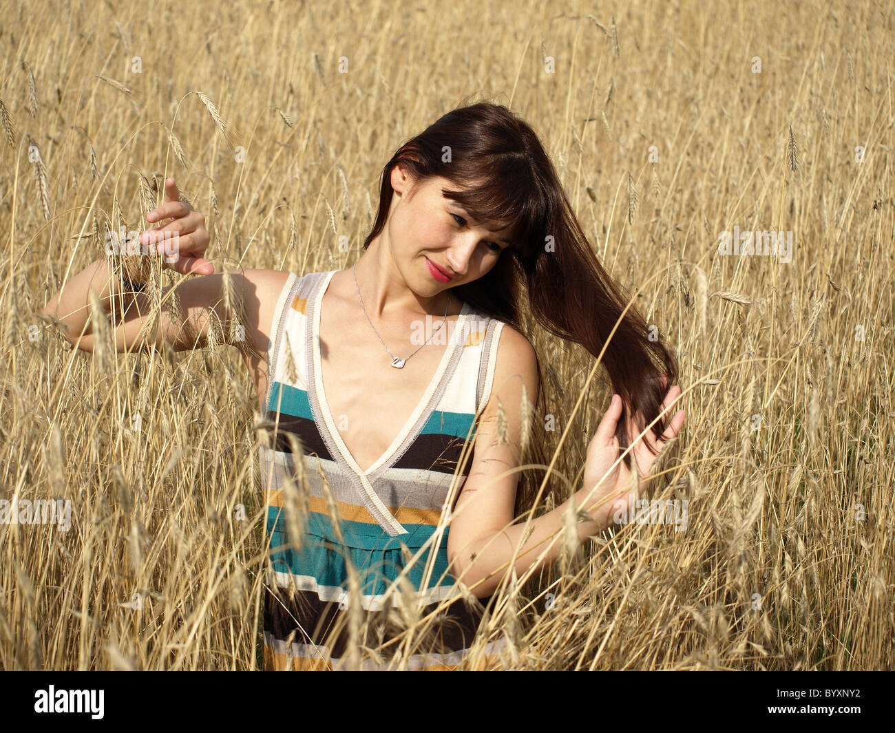 beautiful woman in the wheat field Stock Photo - Alamy